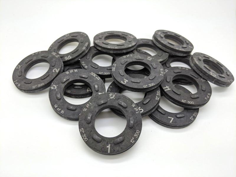 Pile of numbered DTIs from DuraSquirt® Single Pass Flange System